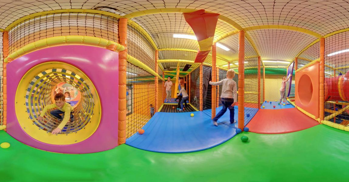 Children playing in an indoor playground. Children playing in an indoor playground.